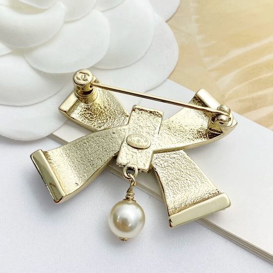 25 new bow pearl brooch